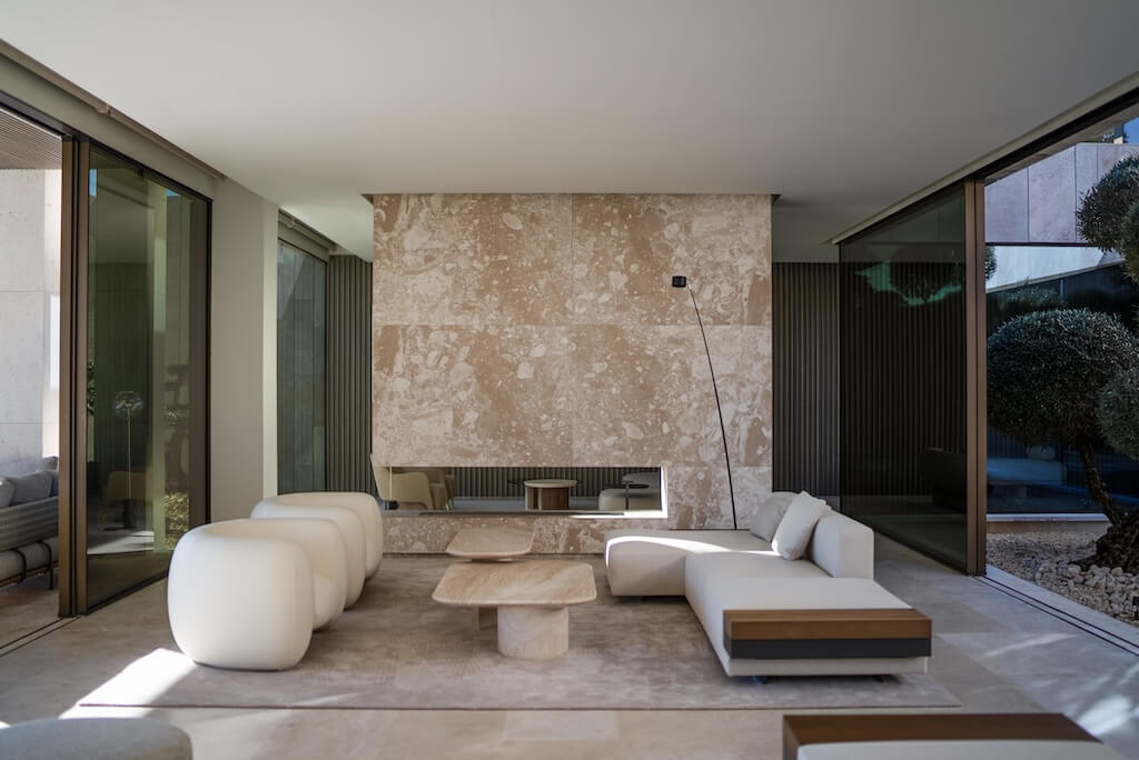 Contemporary interior with stone, glass and garden views, from the ESTAIT homepage